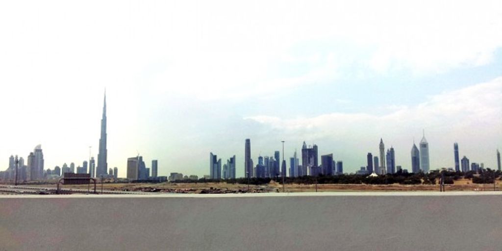 skyline of Dubai with people moving in