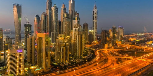 Dubai skyline at sunset with people enjoying at a luxury cafe